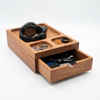 Thumbnail for A rectangular wooden jewelry and watch storage box with a top tray and a pulled-out drawer, shown on a clean white background. The box is filled with a black watch, coins, rings, and a bracelet.


